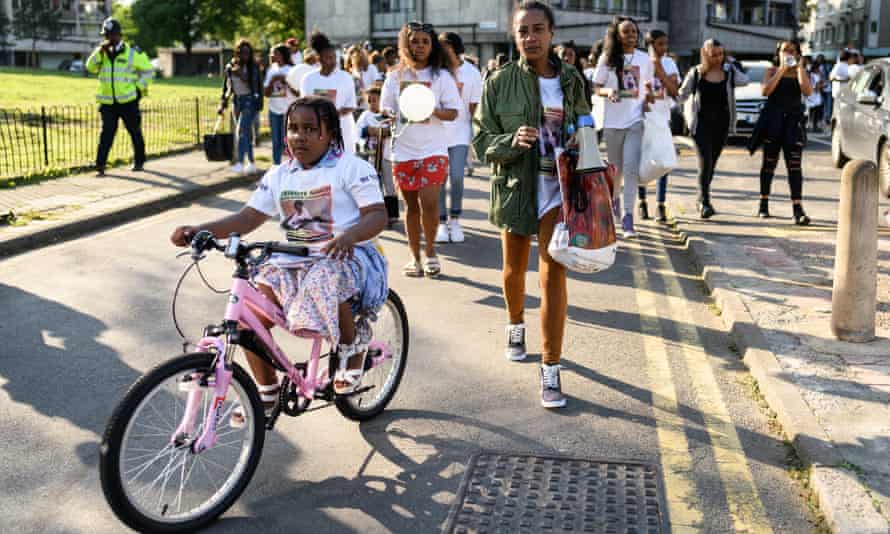 Pretana Morgan, Rhyhiem Barton’s mother, walks with her daughter at the start of a solidarity march in May 2018.