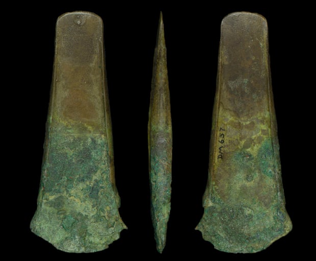 A bronze age flanged axe found alongside a human bone musical instrument.