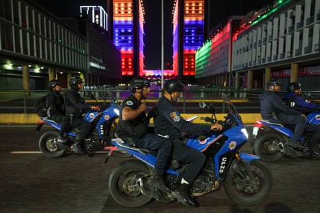 Bolivarian national police force officers patrol the streets in Caracas, Venezuela, on Saturday.