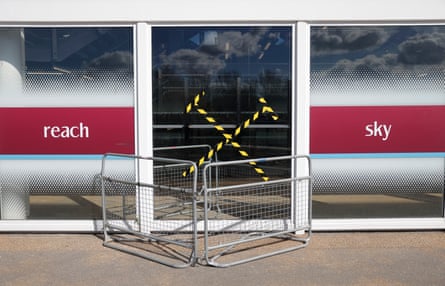 A cordoned off door, with tape in the shape of crossed irons.