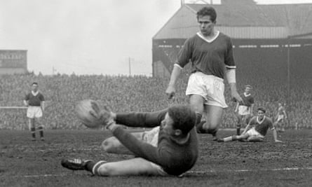 Wilf McGuinness watches Manchester United teammate Harry Gregg save a shot in a 1959 victory over Everton.