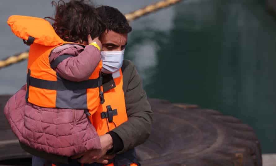 A man carrying his small child