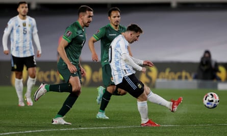 Messi fires home his first goal against Bolivia.