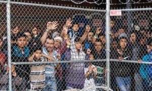 Migrants being held for processing under the Paso del Norte bridge in El Paso, Texas on 27 March.