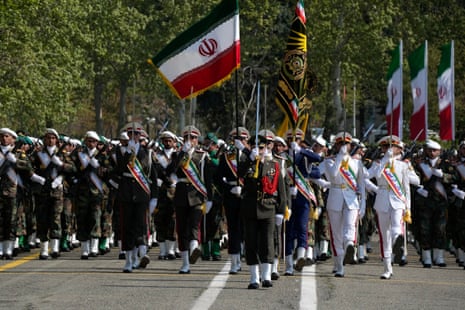 Iranian army members march during the Army Day parade at a military base in northern Tehran.