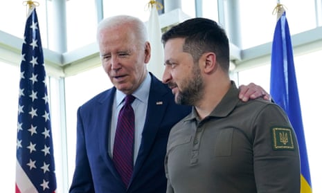 President Joe Biden walks with President Volodymyr Zelenskiy and places his arm around the Ukrainian president's shoulder at the G7 summit in Hiroshima, Japan, in May.