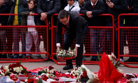 Andy Burnham lays a wreath.