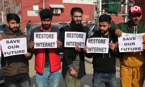 Young Kashmiri men protest against the internet, SMS and prepaid mobile services blockade, in Srinagar