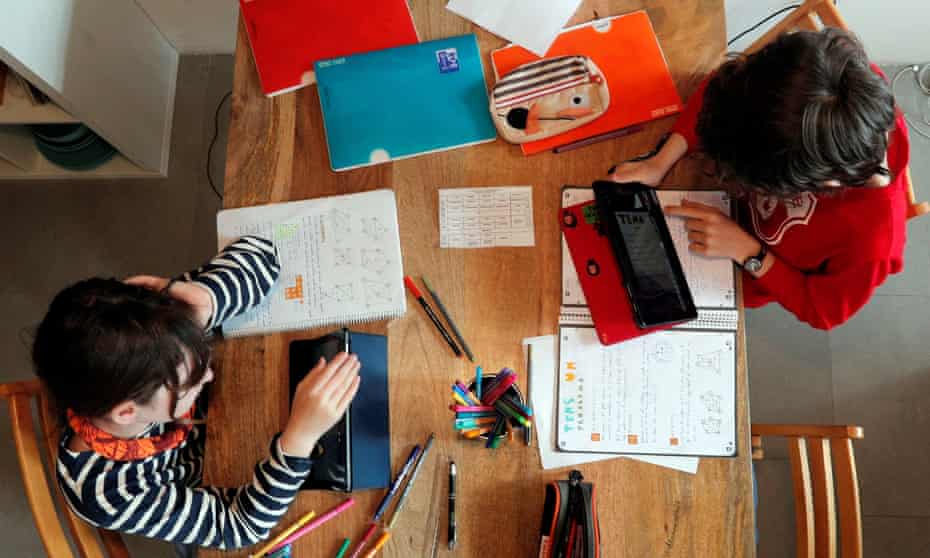 Children seen working at home from above