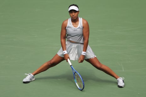 Naomi Osaka with legs spread out on court