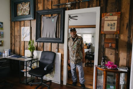 man stands in doorway of office