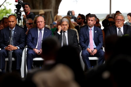NZEALAND-MAORI-LUXON-WAITANGINew Zealand Prime Minister Christopher Luxon (2nd L), Foreign Minister Winston Peters (C), Deputy Prime Minister David Seymour (2nd R), and fellow parliamentarians attend a ceremony commemorating Waitangi Day in Waitangi on February 5, 2026