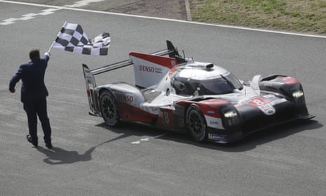 The Toyota TS050 Hybrid No 8 of the Toyota Gazoo Racing Team crosses the finish line to win the 88th Le Mans race