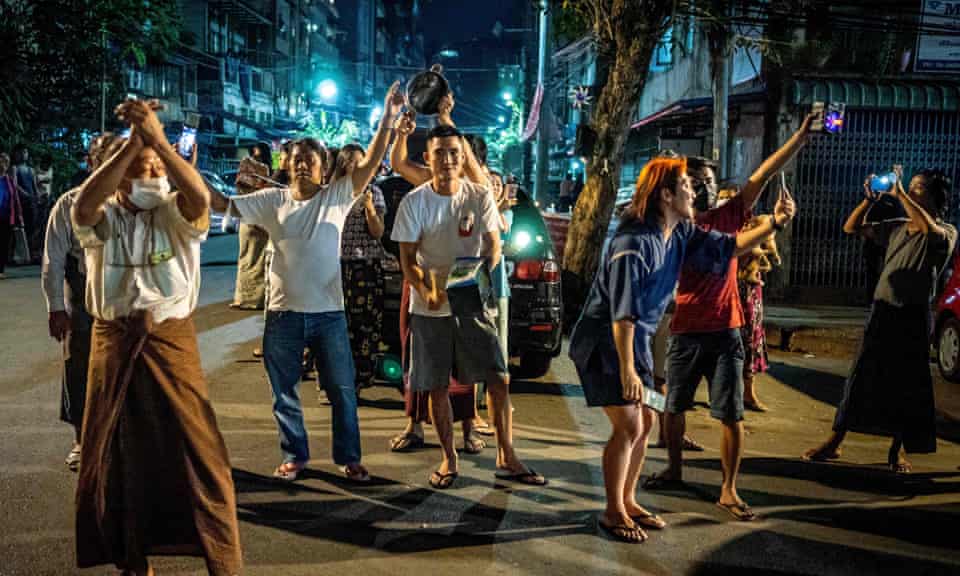 People make noise on a street in Yangon after calls for protest went out on social media