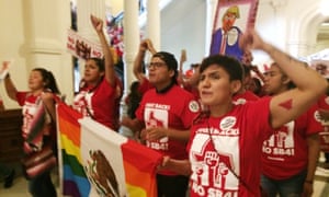 Demonstrators march in the Texas Capitol on Monday.