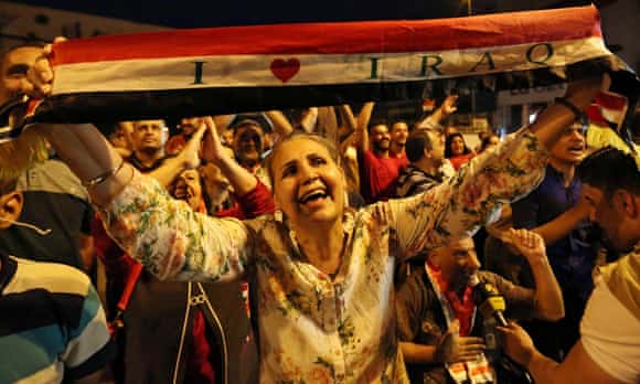 Iraqis in Baghdad celebrate the liberation of Mosul