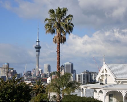 A Victorian house against city skyline in Auckland, New Zealand, 2018.