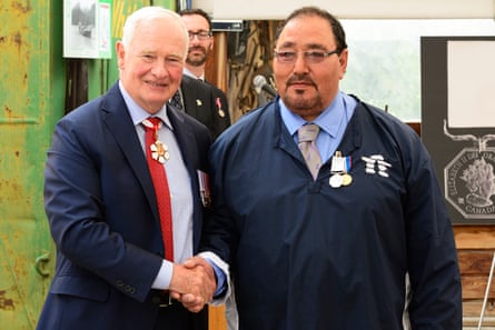 Louie Kamookak receives the Polar Medal from the governor general.