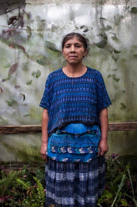 An older woman in a blue traditional dress