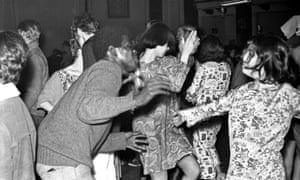 Hippies dance at a psychedelic rock concert at the Fillmore auditorium in San Francisco, California.
