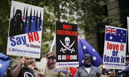 Supporters carry banners and signs as they attend a Reclaim Australia rally in Sydney. Sunday, November 22, 2015