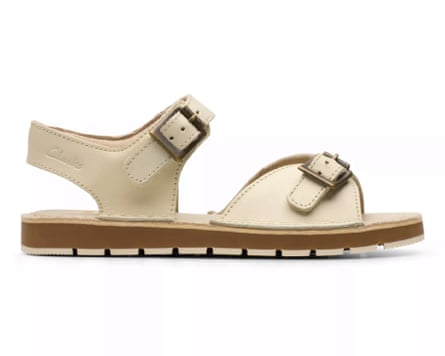 A side view of an off-white Clarks Playsun Kids sandal with toe and ankle straps.