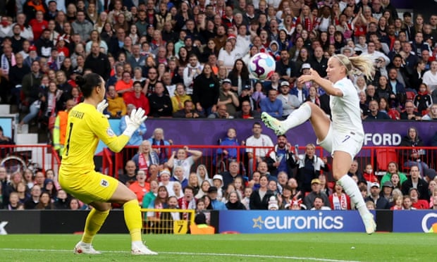 England's Beth Mead scores their first goal.