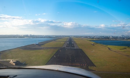 A hobby pilot prepares to land his plane at Sydney airport on Sunday
