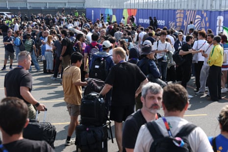 Members of the media and staff queue to enter New York New Jersey Stadium on Sunday
