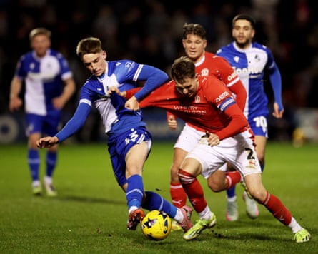 Ollie Dewsbury is challenged for the ball