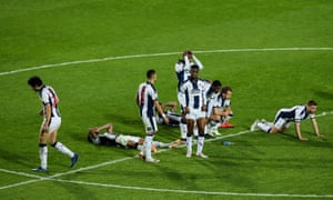 West Bromwich Albion's downed players react after losing on penalties.