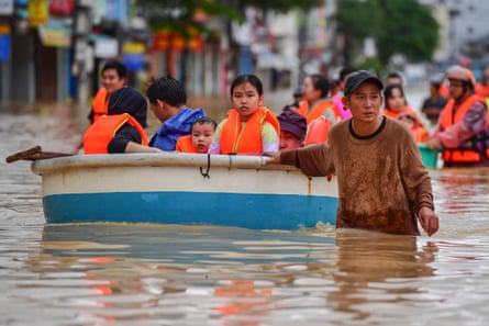 People wade through floodwater in Nha Trang, Khanh Hoa province, Vietnam, on 20 November.