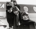 The Beatles getting off an aeroplane