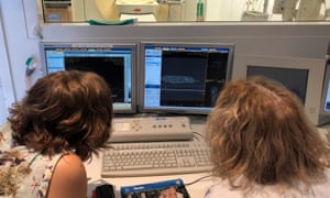 Candace Richards        and Helen Laurendet watch as the ibis mummies are scanned.