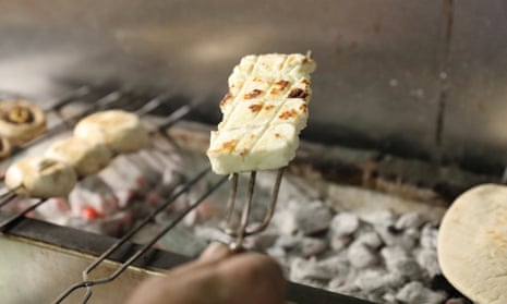 A chef grills halloumi in a restaurant in Nicosia.