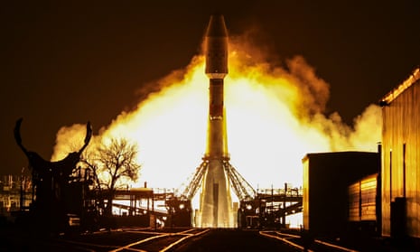 A carrier vehicle containing 36 OneWeb communication satellites lifts off from Baikonur cosmodrome in Kazakhstan.