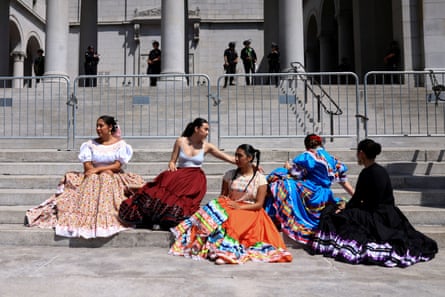 a group of people in long skirts
