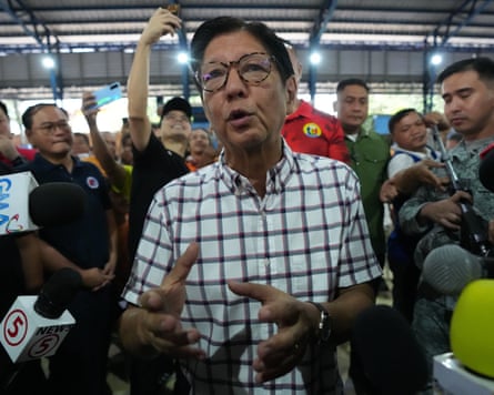 Philippine President Ferdinand Marcos Jr talks to reporters as he observes a cash relief assistance centre to help tricycle drivers in their livelihood as oil prices continue to rise.