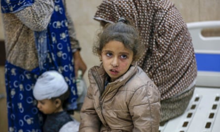 An injured girl is among those brought to al-Aqsa Martyrs hospital in Deir al-Balah