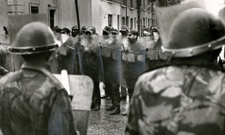 The Ulster Defence Association confront the army in Belfast in 1972. 
