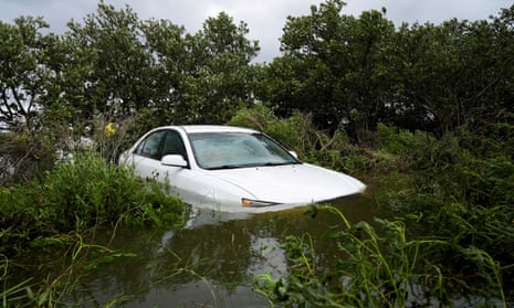 A vehicle is partially submerged after the arrival of Hurricane Idalia in Cedar Key, Florid.