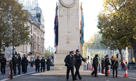 The Cenotaph, surrounded by police, in London this morning.