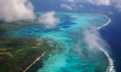 Aerial view of the east coast with coral reef and mangrove edged shoreline, Yap Island, Micronesia