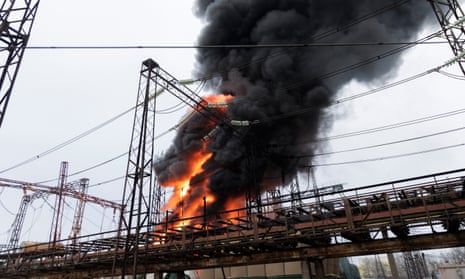 Flames and smoke rise from a blaze at an electricity facility after a Russian attack in Kharkiv, Ukraine, on Friday 22 March 2024.