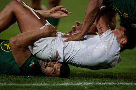South Africa's Damian de Allende's head is squashed by George Furbank