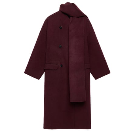 A long burgundy coat with a scarf detail on a white background