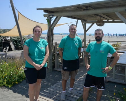 Rachele, Marco and Alessio pose in uniform green T-shirts and shorts at Il Tirreno