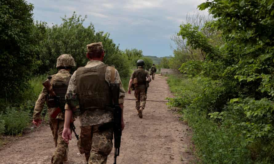 Ukrainian servicemen patrol an area near a frontline, as Russia’s attack on Ukraine continues, in Donetsk Region, Ukraine May 29, 2022.