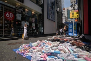 Electric fans are displayed for sale on a street in the Myeong-dong shopping district in Seoul, South Korea