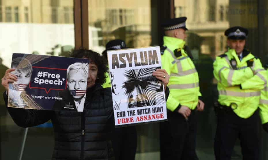 UK police arrest WikiLeaks founder Julian AssangeLONDON, UNITED KINGDOM - APRIL 11: A protester holds banners reading “Free Speech - Except War Crimes - Asylum - End The Witch Hunt Free Assange” during a protest outside Westminster Magistrates court, in London, United Kingdom on April 11, 2019. The Wikileaks co-founder was arrested earlier today after taking refuge at the Ecuadorian embassy seven years ago to avoid extradition to Sweden. (Photo by Kate Green/Anadolu Agency/Getty Images)